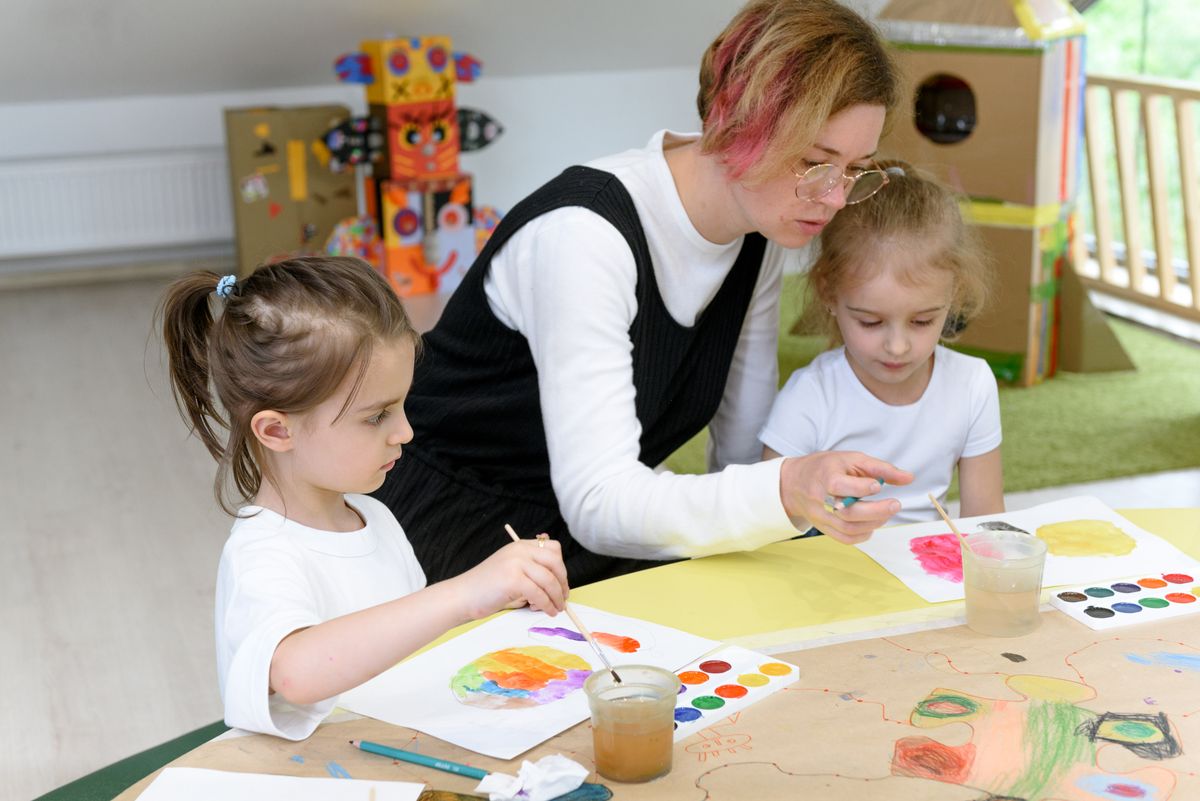 Montessori teacher with children at Shining Star Montessori Preschool